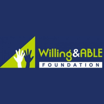 Green triangular icon with two raised white hands beside the text "Willing & ABLE Foundation," on a navy blue background.